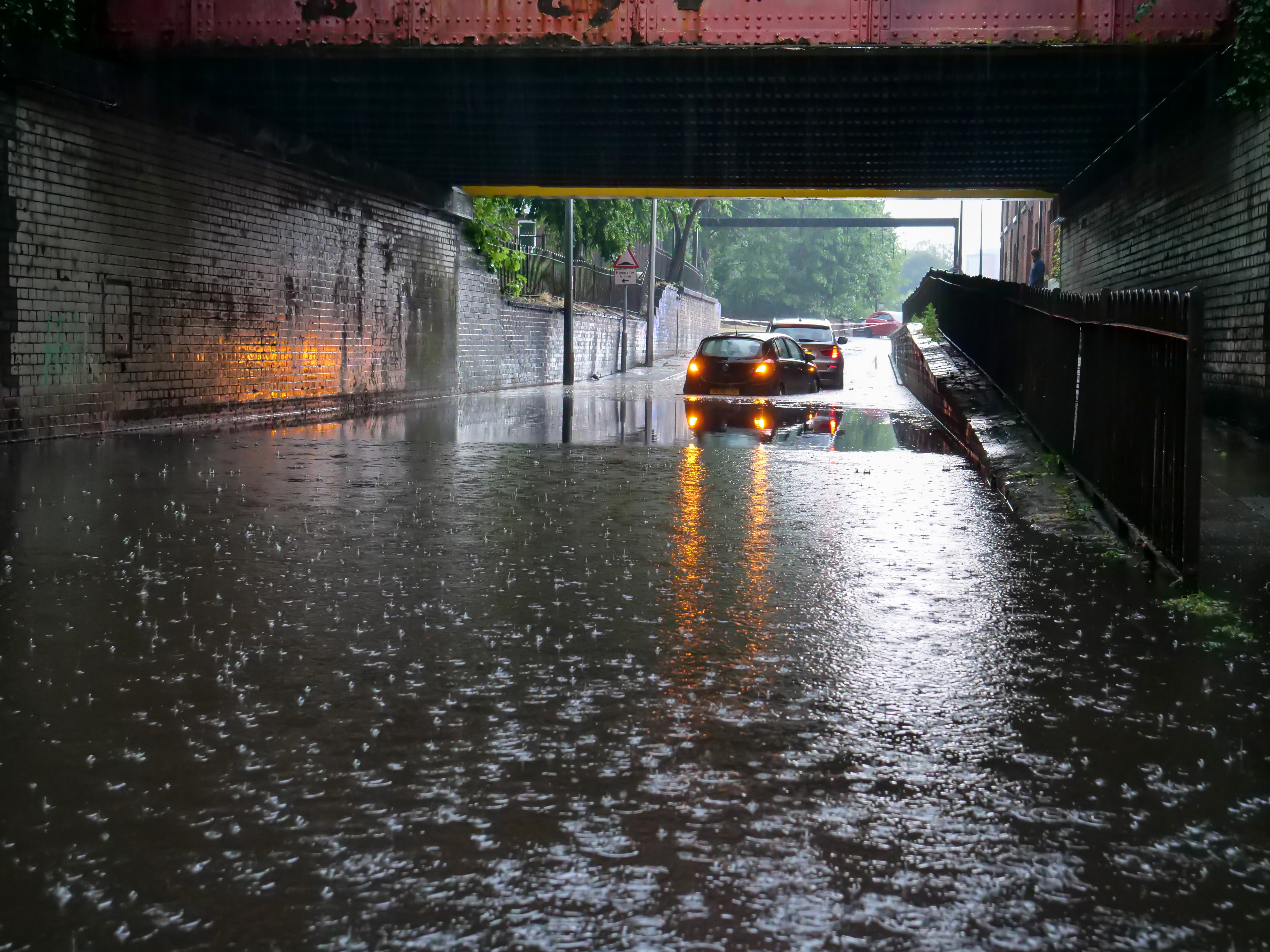 Flooded Underpass with Cars